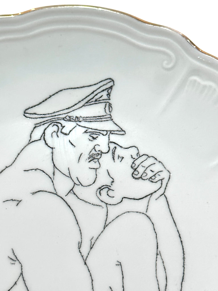 Omri Danino Porcelain Plate engraved with a drawing of older man and younger man during intercourse in black on white, older man is with uniform hat and gagging younger man from behind - detail - faces