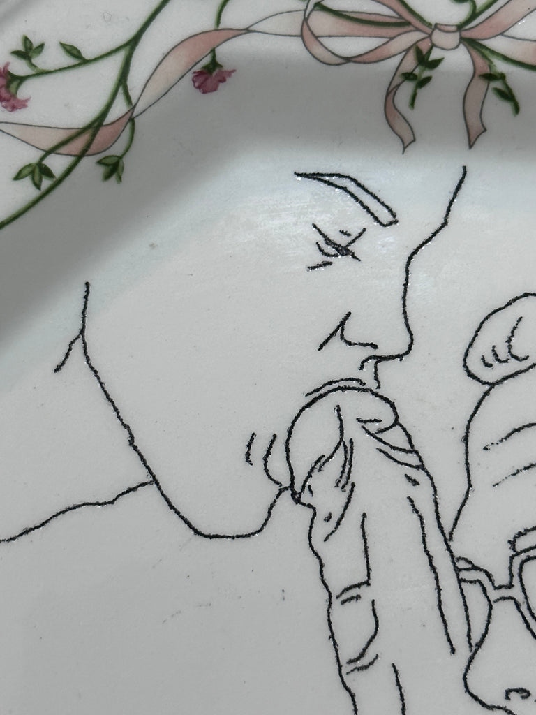 Omri Danino Porcelain Plate engraved with a drawing of gay sex threesome in black on white, hairy chested bearded man is being fellated by two men - detail - face of younger man fellating older man
